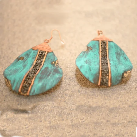 Big drop earrings handcrafted from reclaimed bronze with natural pyrite accents in San José del Cabo.