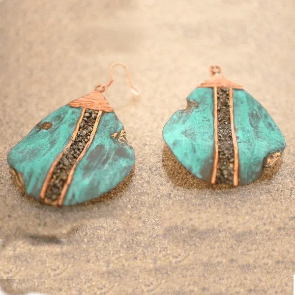 Big drop earrings handcrafted from reclaimed bronze with natural pyrite accents in San José del Cabo.