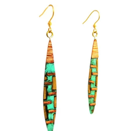 Long oval bronze earrings handcrafted with a bohemian style and textured finish in San José del Cabo.