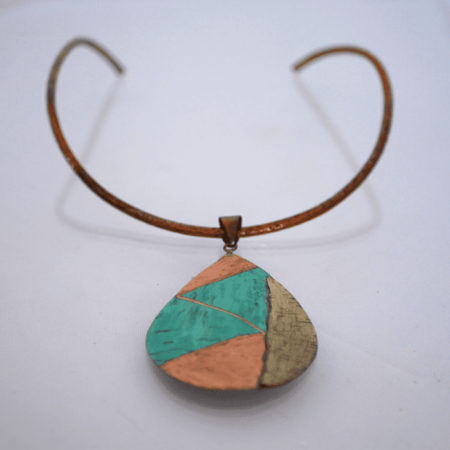 Big Bronze Drop Necklace With irregular Textures and Lateral metal